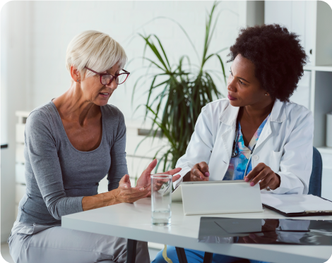 Woman patient speaking with woman doctor